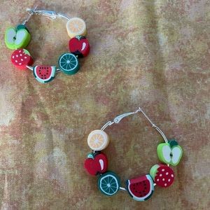 Handmade earrings.  Resin fruit on silvertone hoop. 2”